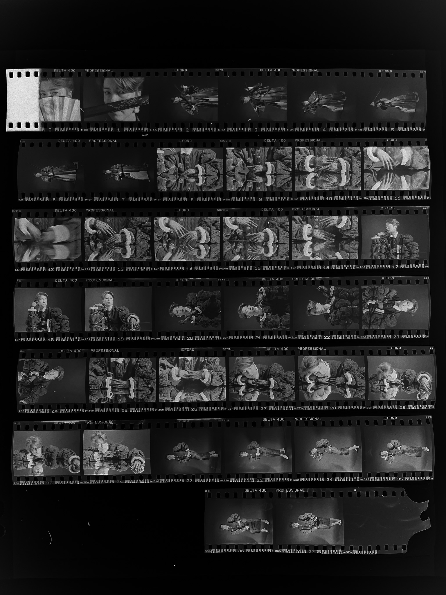 Contact sheet of the Yulia series — six strips of Ilford Delta 400 negatives