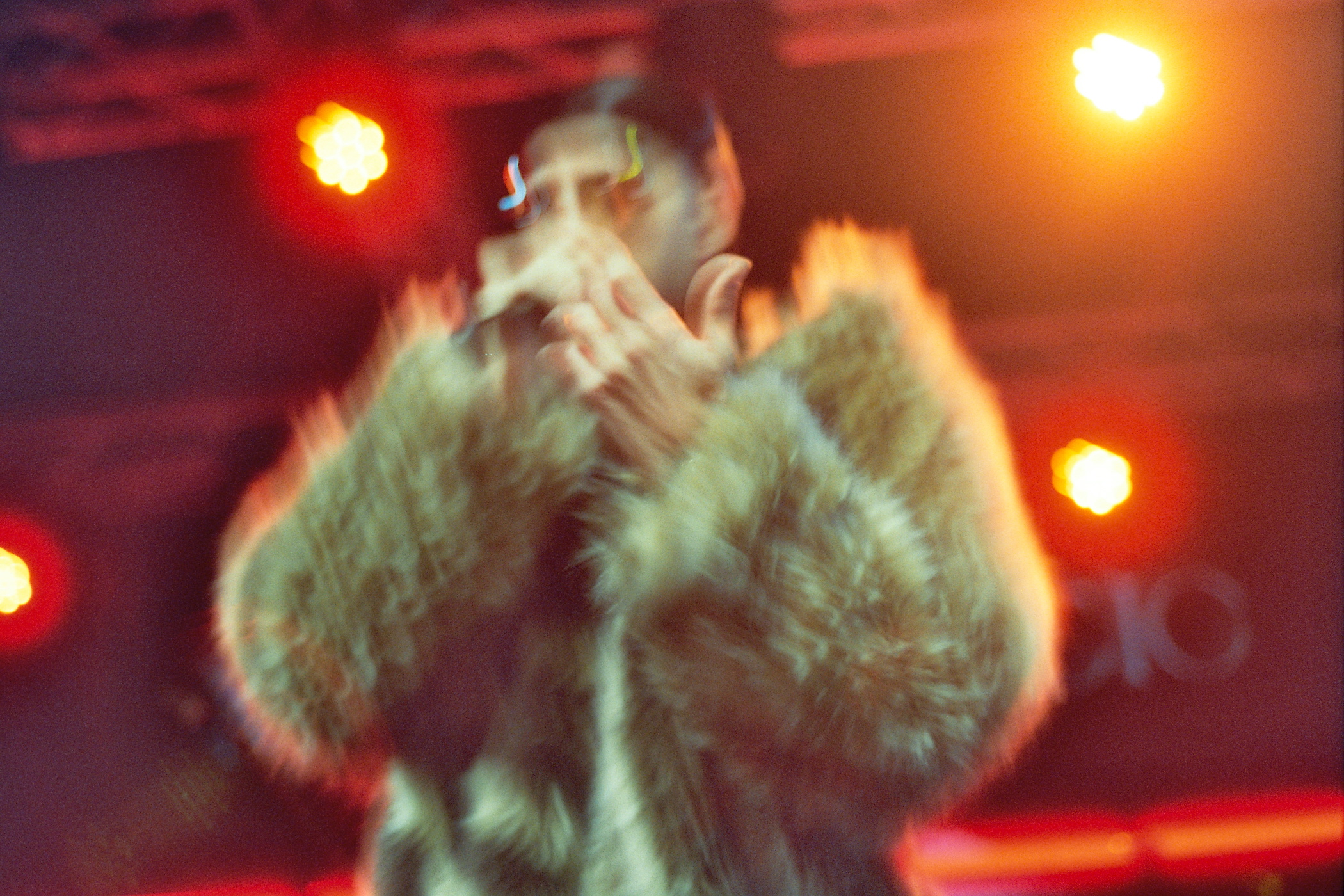 Concert — the performer on stage, frame 1 of 3