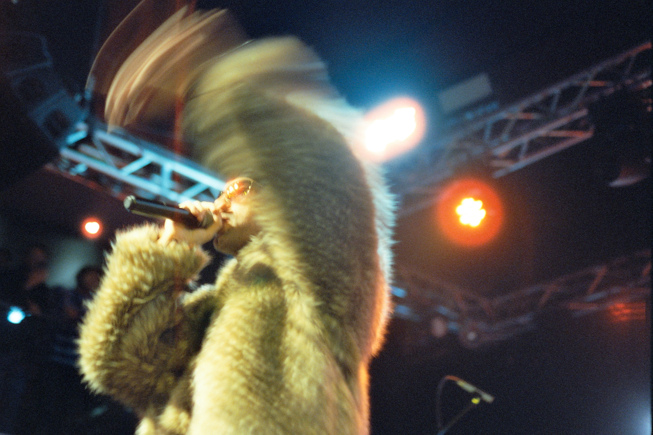 Concert — the performer on stage, frame 3 of 3